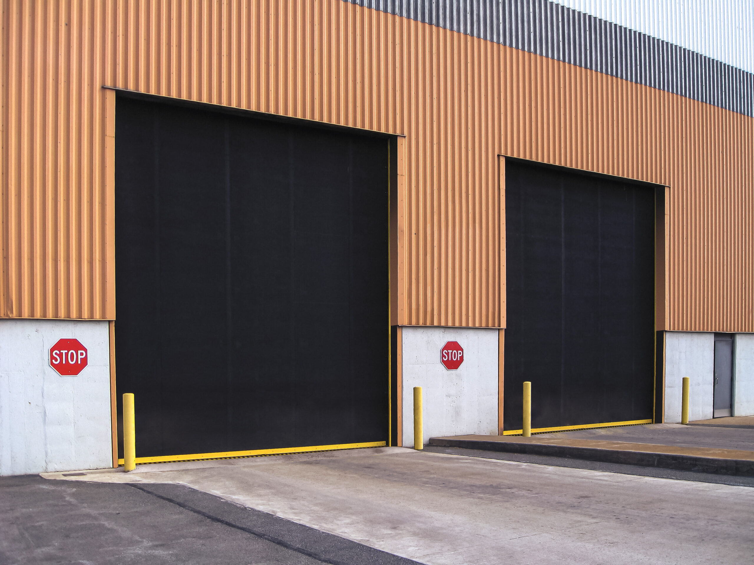 Close-up image of a high-tech security system seamlessly integrated with industrial steel doors