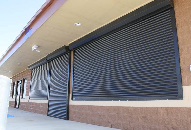 Bustling Coffee Shop Interior with Space-Efficient Roll Up Doors