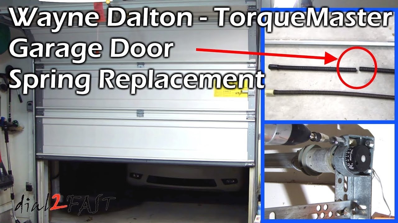 Garage door technician replacing Wayne Dalton Torquemaster spring