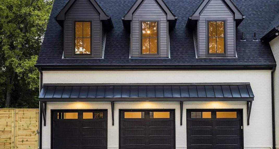 Stylish matte black garage doors mid-century ranch setting
