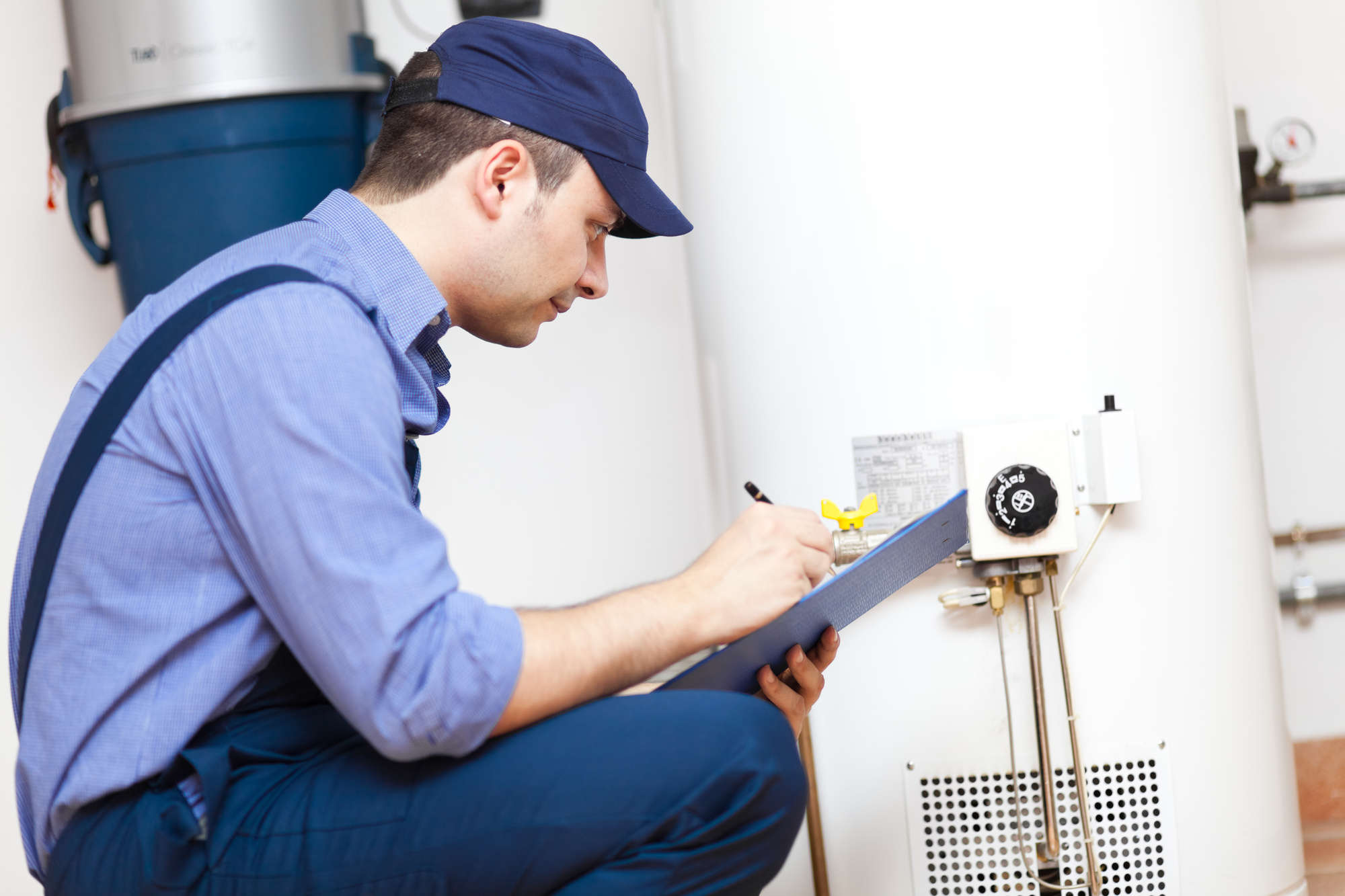 Professional technician conducting garage door maintenance