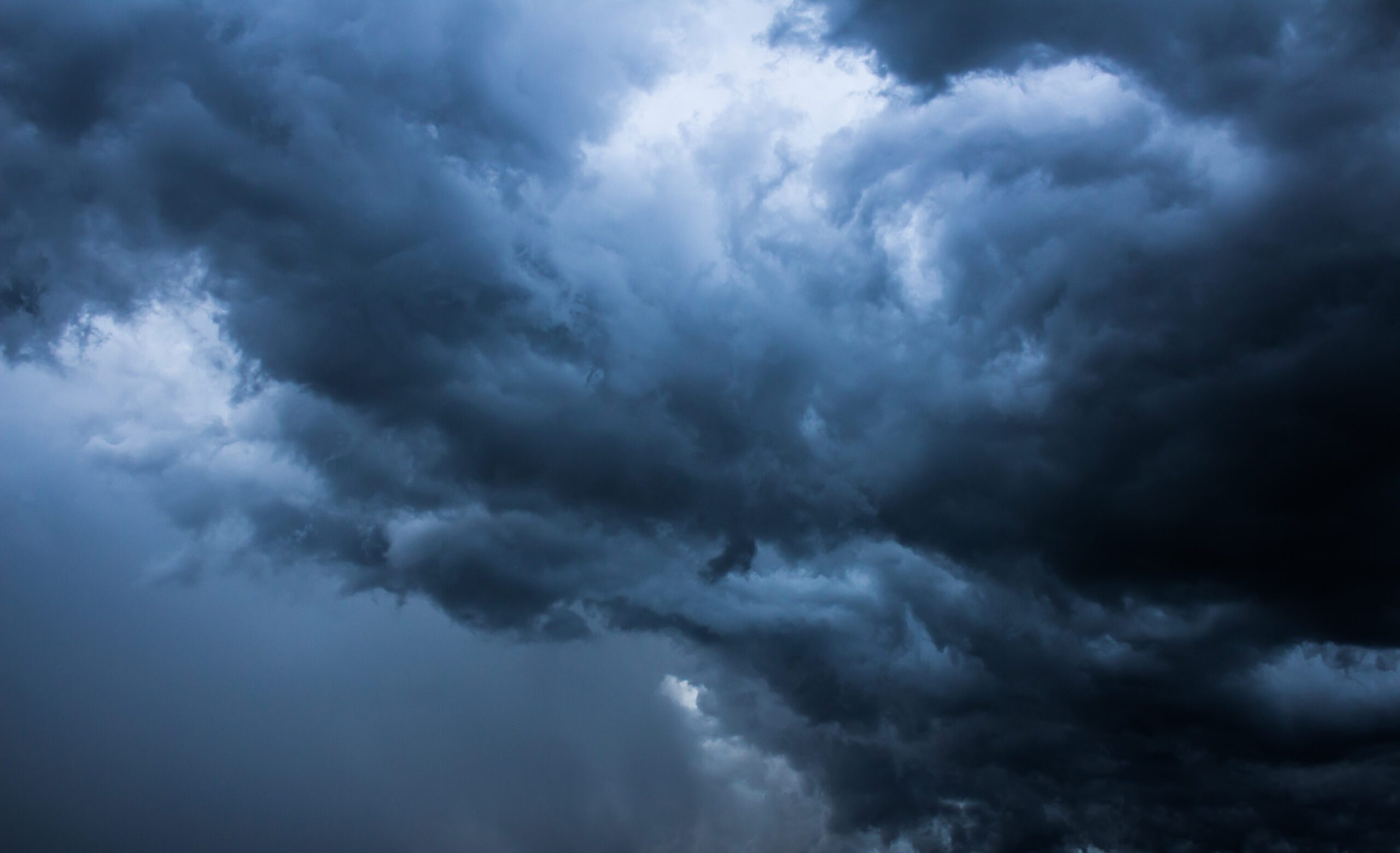 Close-up Hurricane-Resistant Garage Door Storm Clouds Background