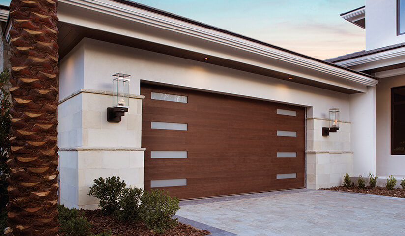 Close-up rustic carriage-style garage door wrought-iron hinges