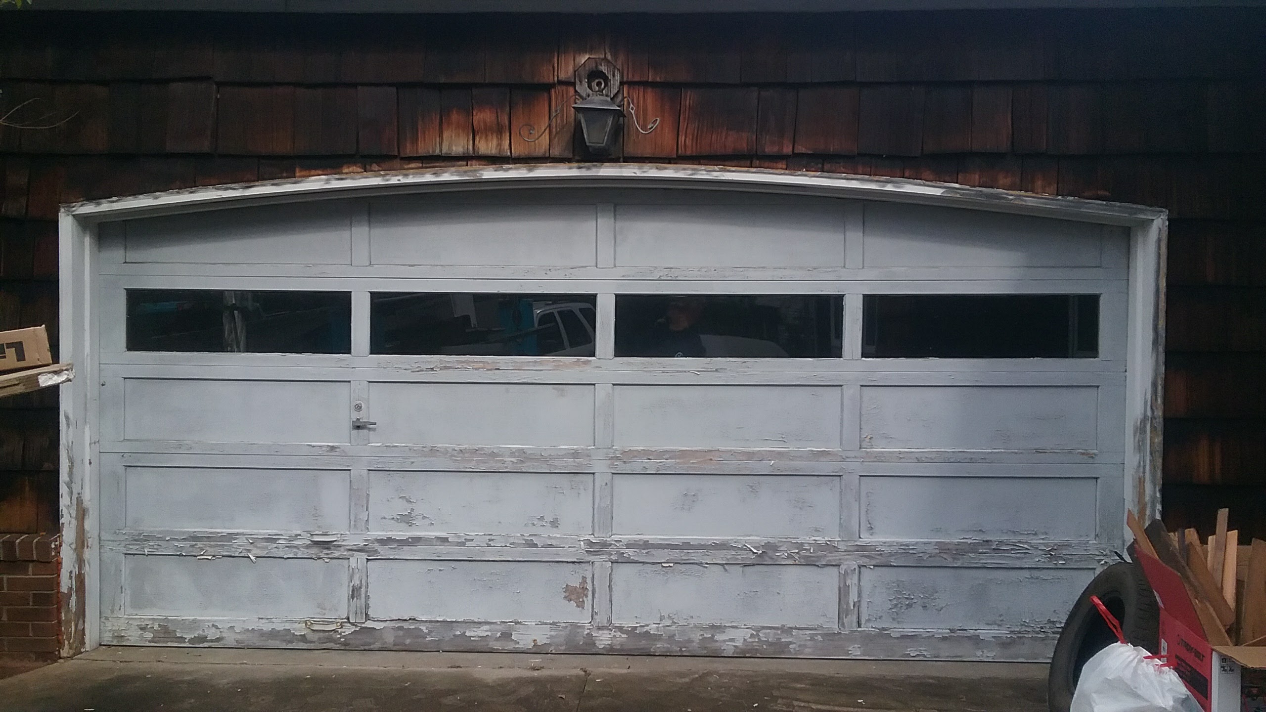 Side-by-side comparison of PVC and wood garage door jamb materials