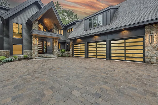 Create a high-resolution image of a sleek, modern garage, showcasing smart technology integration