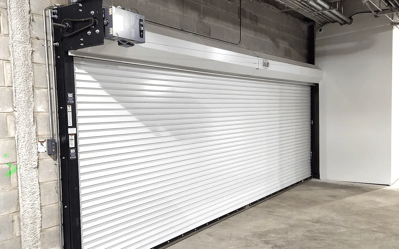 Create a split-screen image showing the transformation of an urban garage with commercial rolling doors