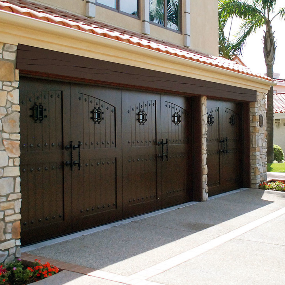 A quintessential rustic Mediterranean home featuring an automatic garage door