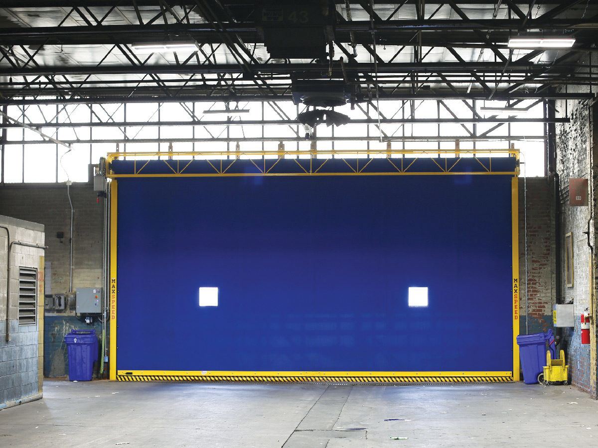 Maintenance Technician Servicing a High-Speed Rubber Door