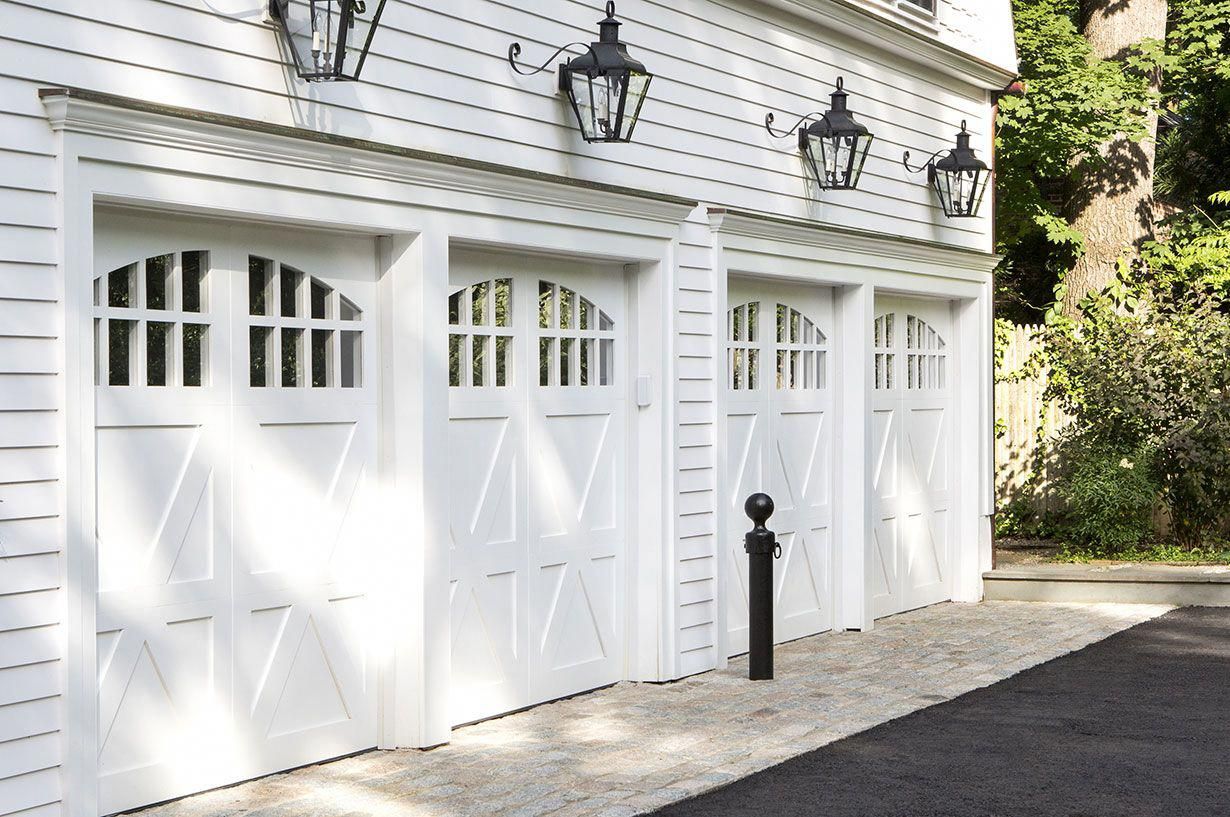 close-up raised panel garage door with traditional decorative hardware