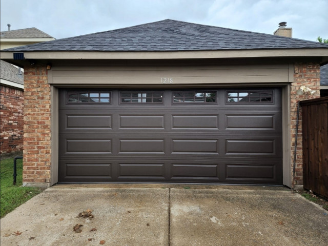 Colonial-style house side view new carriage house garage door