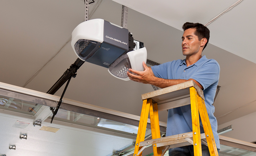 person troubleshooting garage door opener