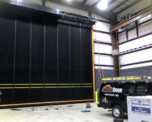 Commercial rolling steel doors installation technician photo