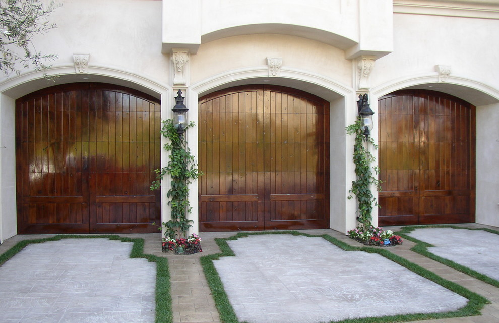 A luxurious coastal villa featuring a sleek, contemporary Mediterranean-style garage door